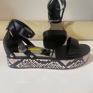 Black Casadei sandal with with python wedge. Size 8